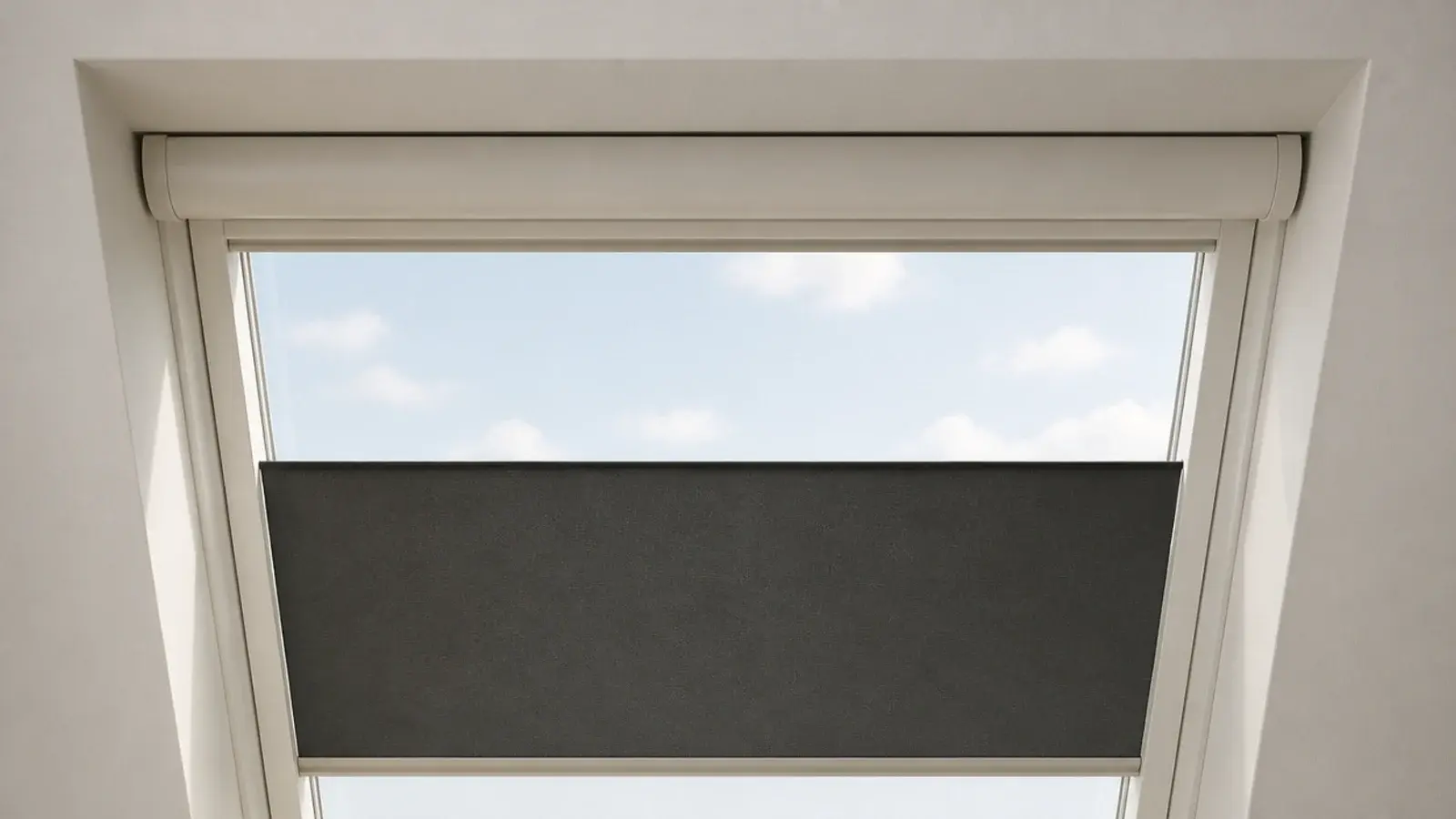 neat blackout blind housing recessed into an attic roof window frame
