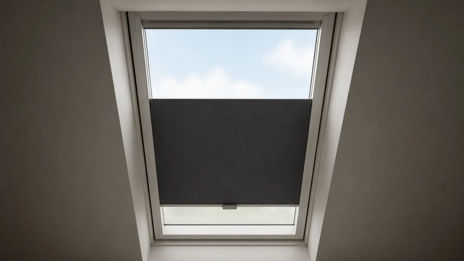 blackout blind running in side channels on an attic roof window