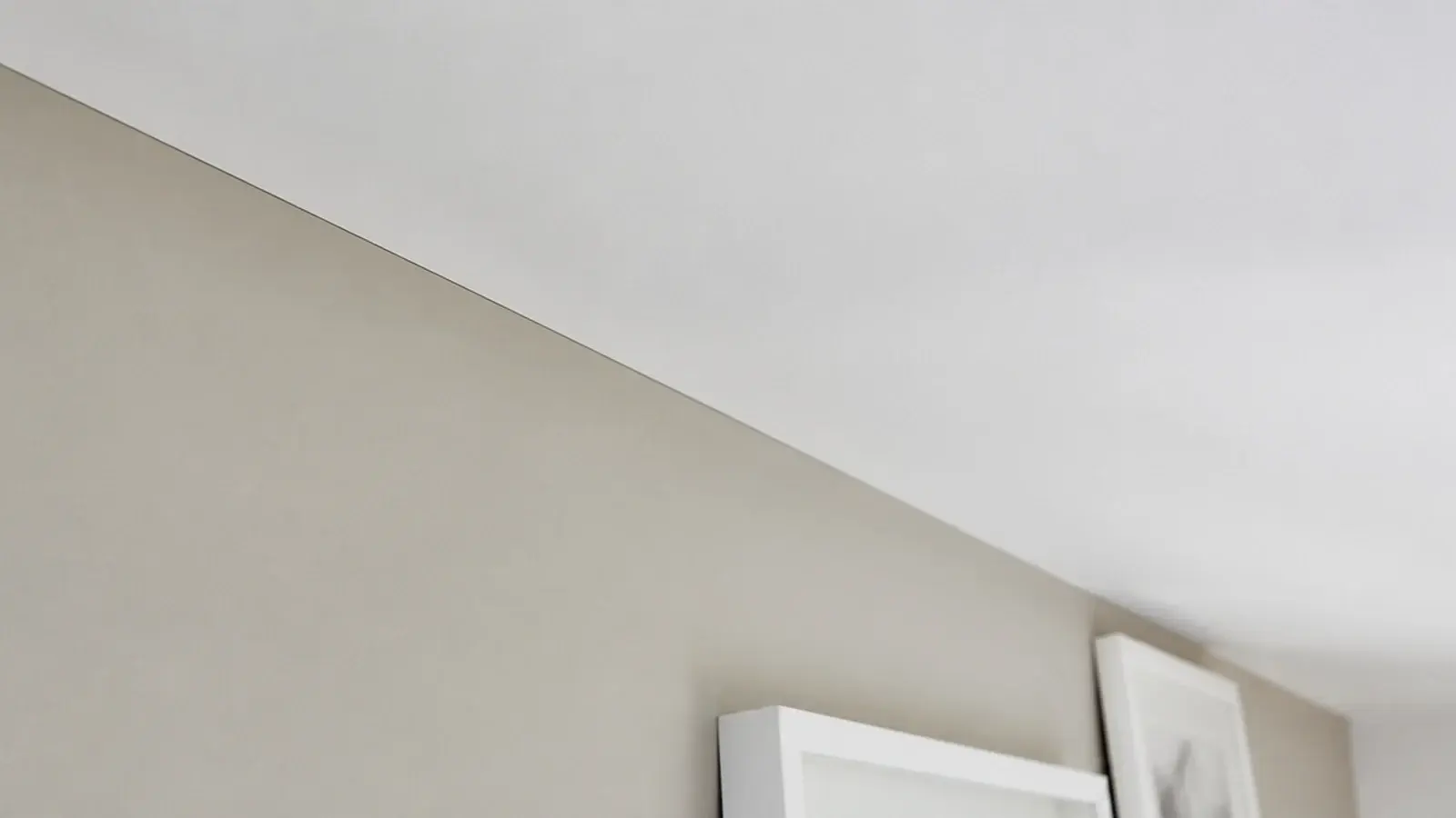plain unadorned junction where an attic slope meets the wall