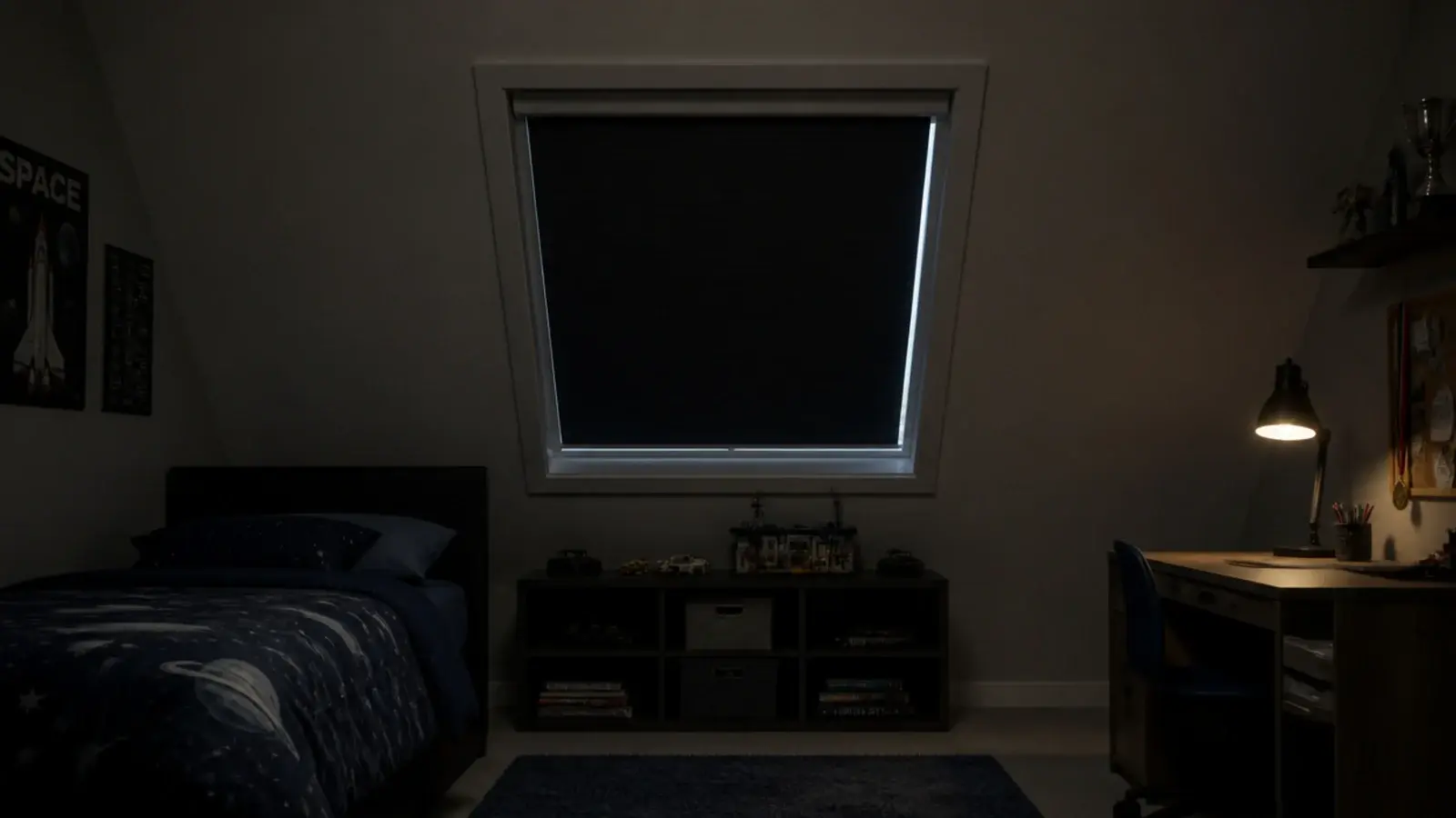 blackout blind pulled down over a boys attic bedroom roof window