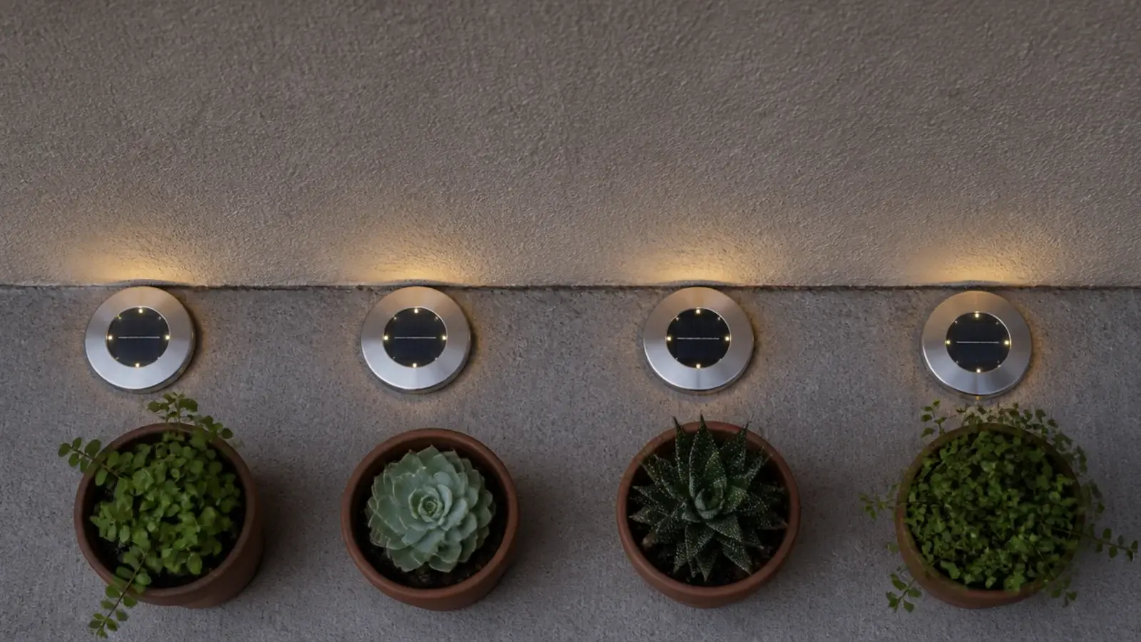 flat solar disc lights lining the floor edge of a small balcony