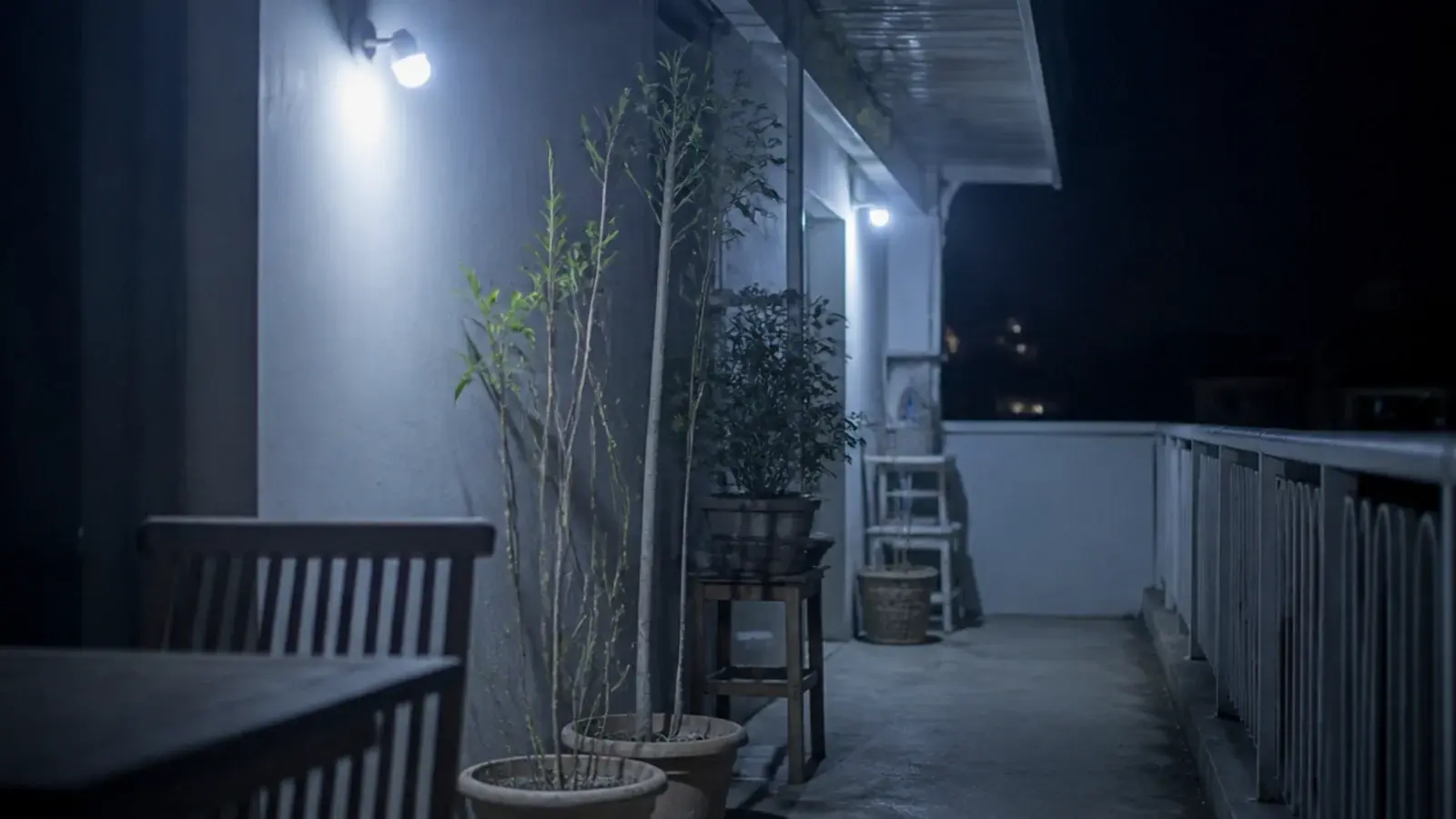 cool white solar lights making balcony terracotta and wood look grey