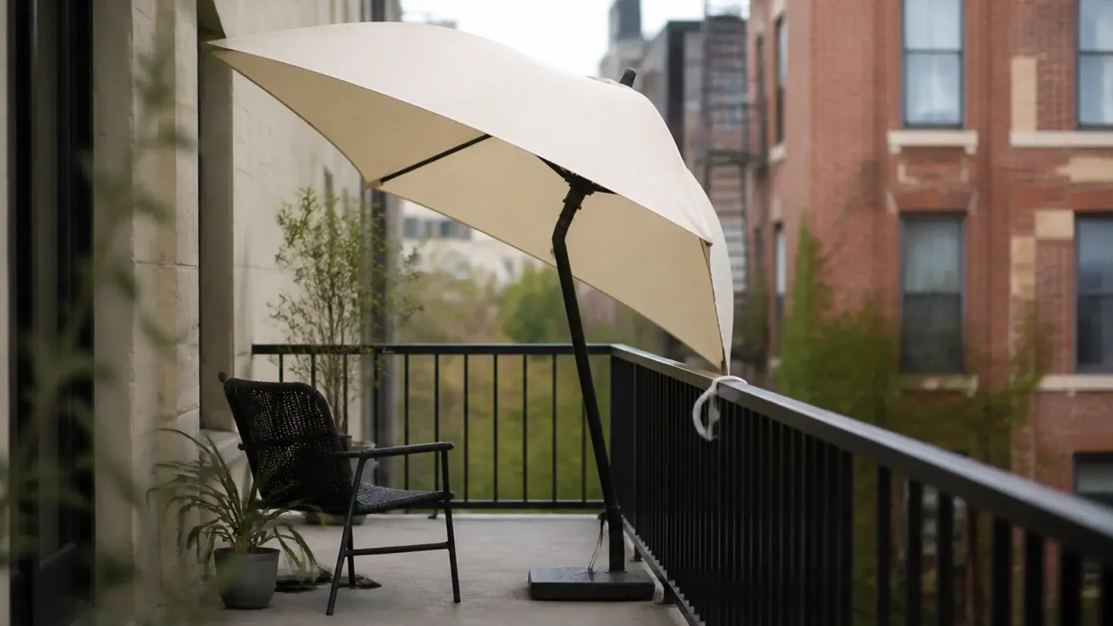 balcony umbrella tilted to block the view from a neighbouring window
