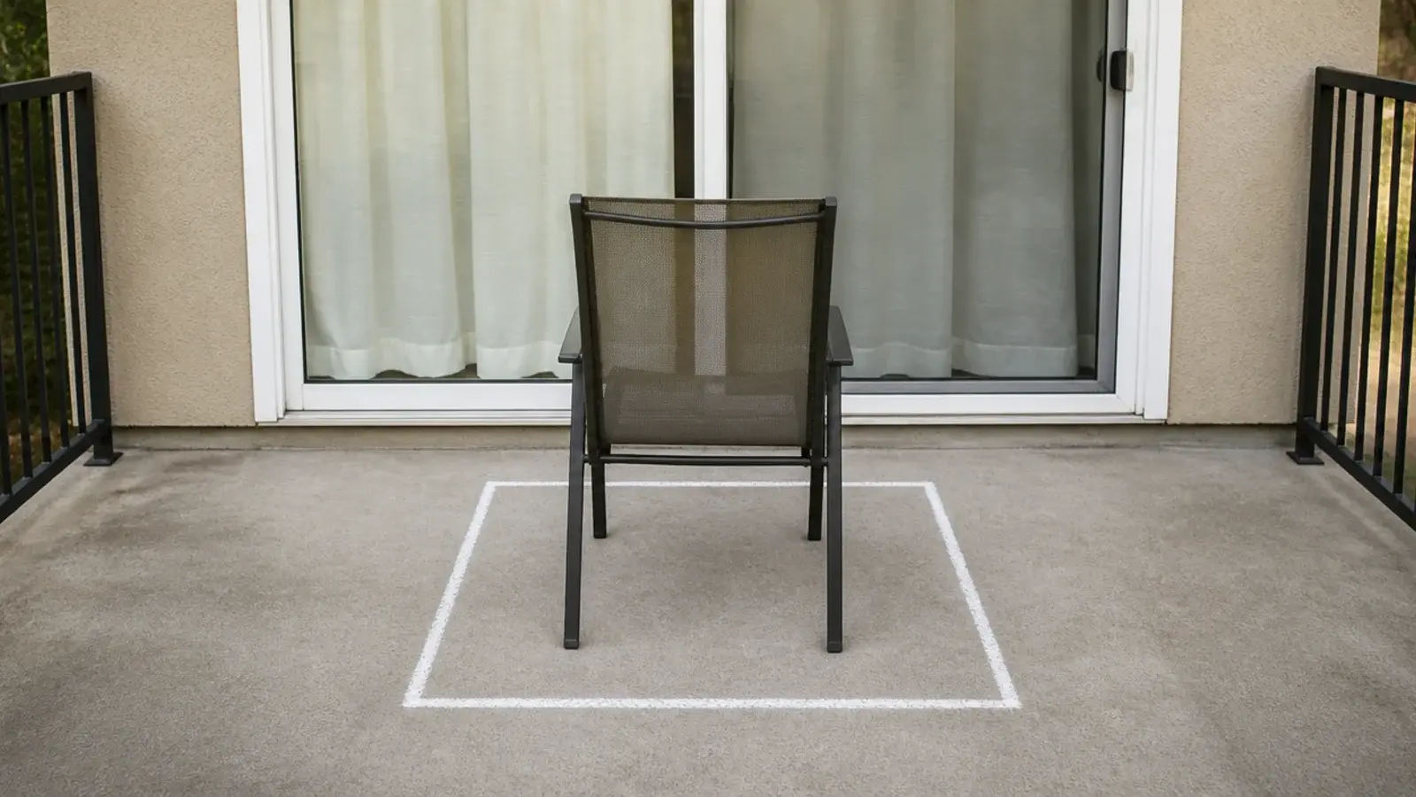 chalk square marking a four foot seating zone on balcony concrete