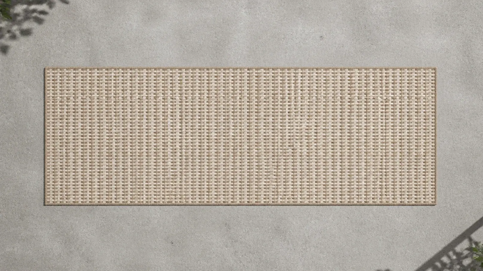 open weave flatwoven runner laid across grey balcony concrete