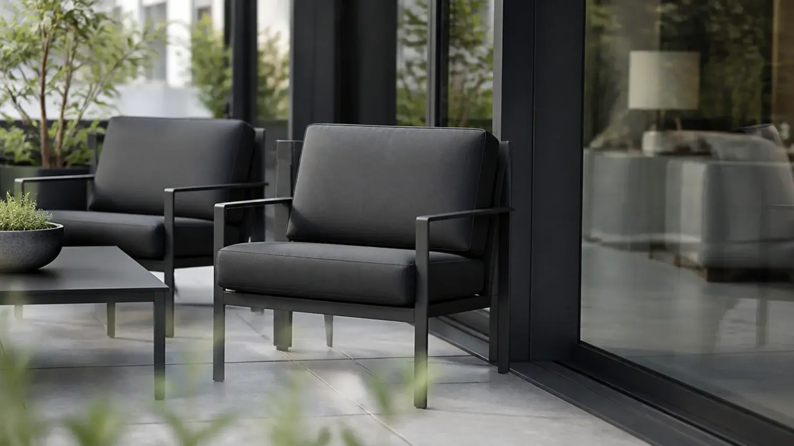 balcony furniture finished to match the dark aluminium door frame