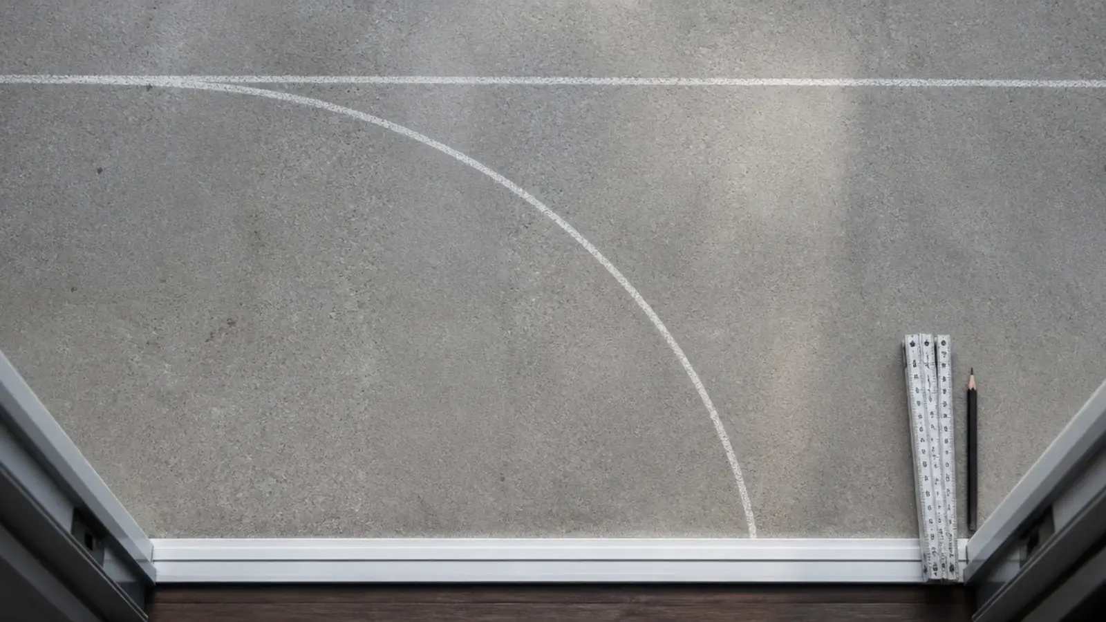chalk arc on balcony concrete marking a sliding door swing clearance