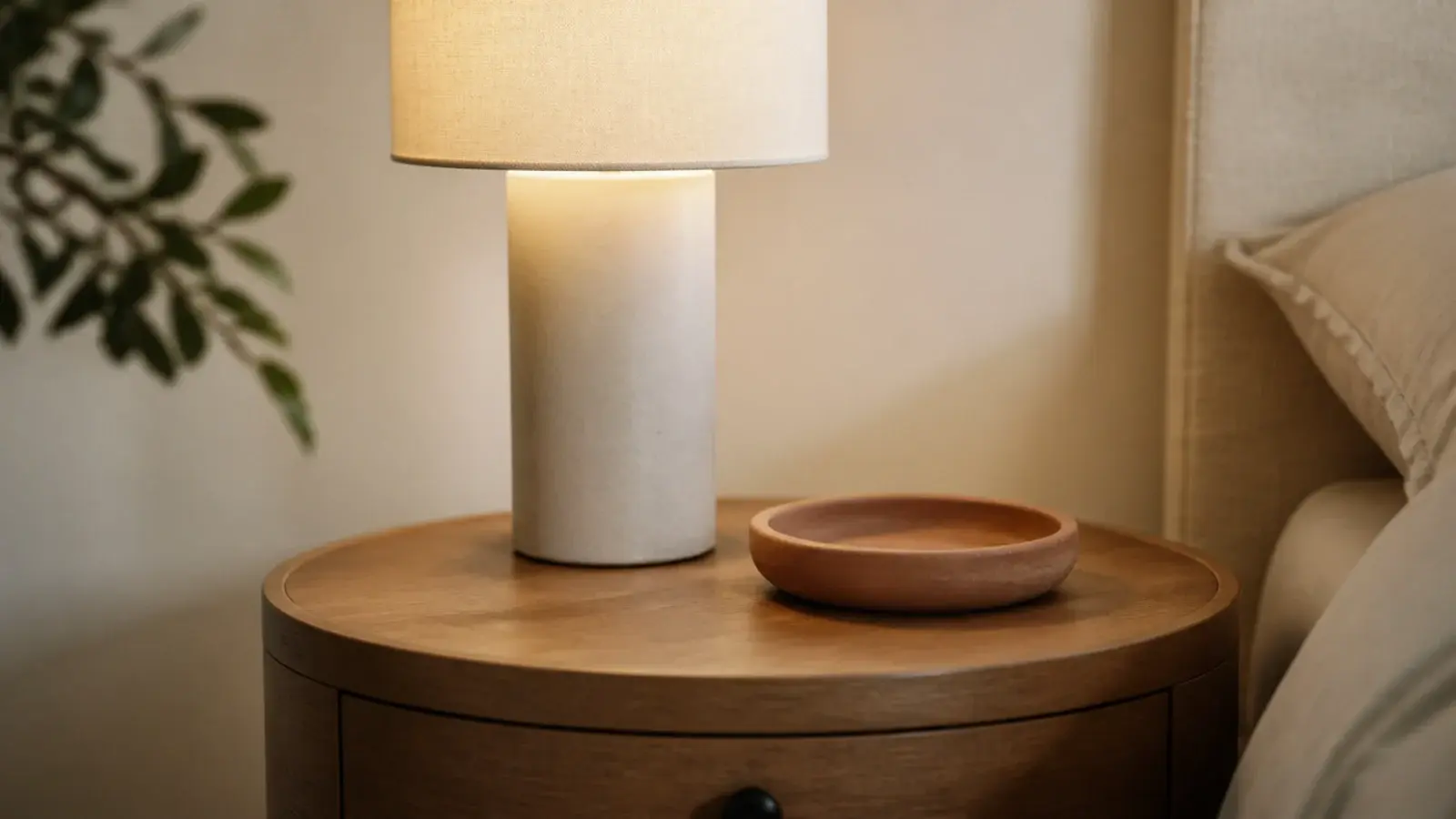 round lamp base round dish and round table edge grouped together