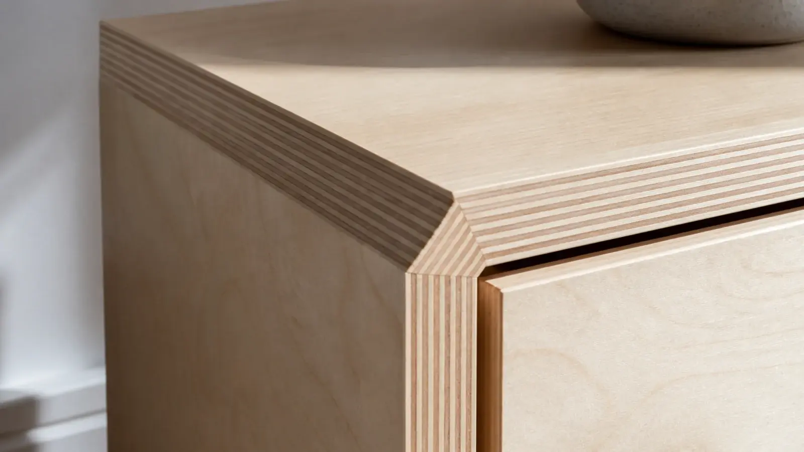 birch plywood nightstand with striped edge laminations turning the corner