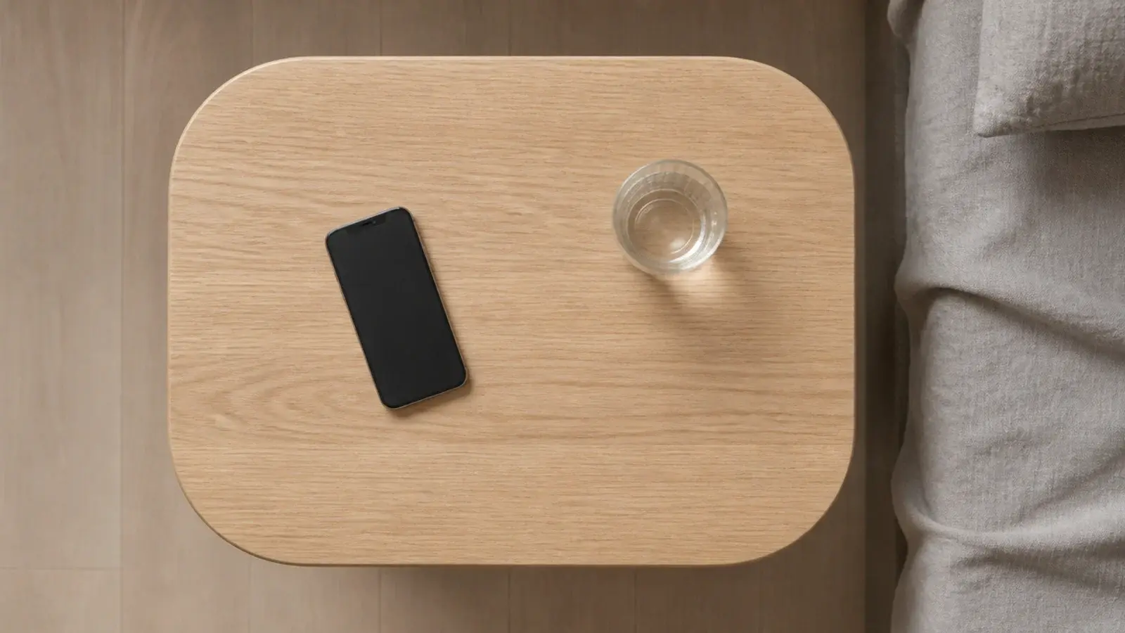 rounded rectangle tabletop with generous soft radius corners in oak