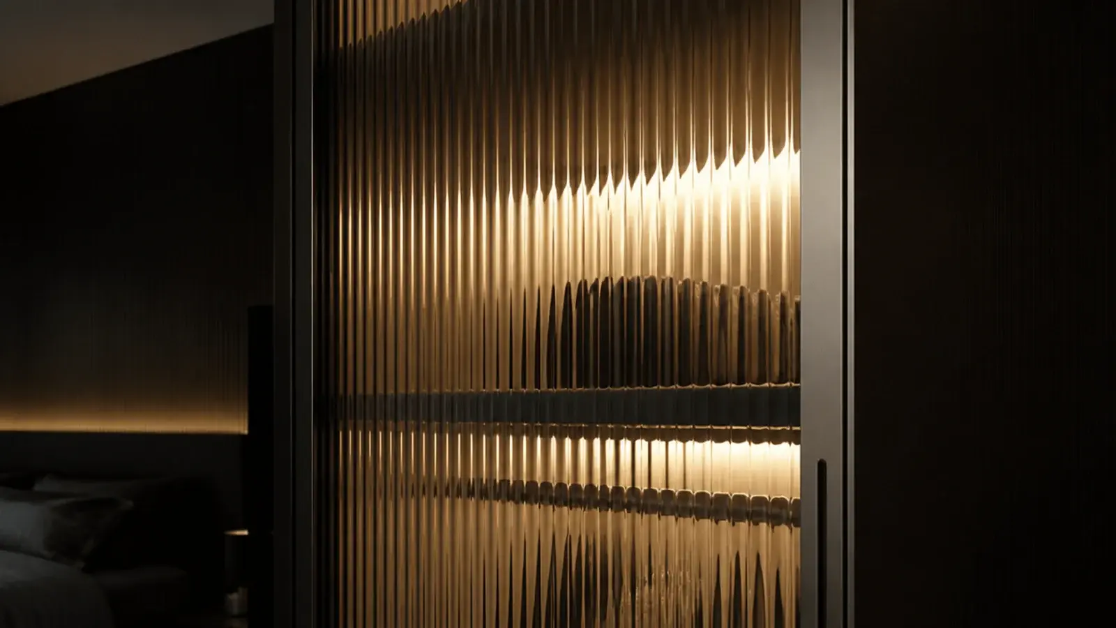 ribbed fluted glass cabinet front glowing softly with light behind it
