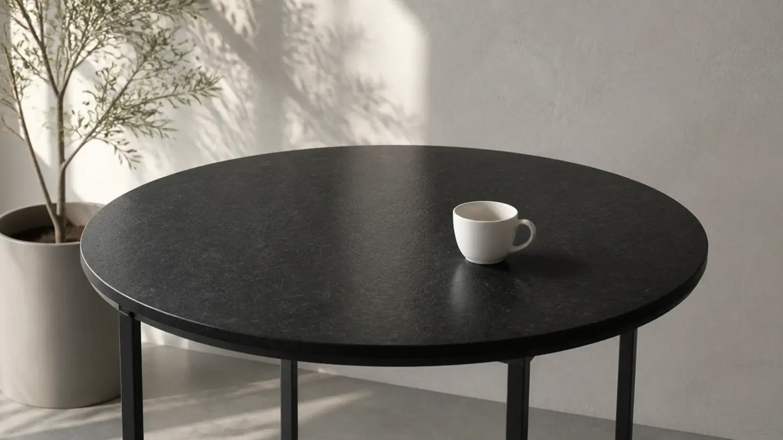 round honed black granite bedside top on a slim dark base