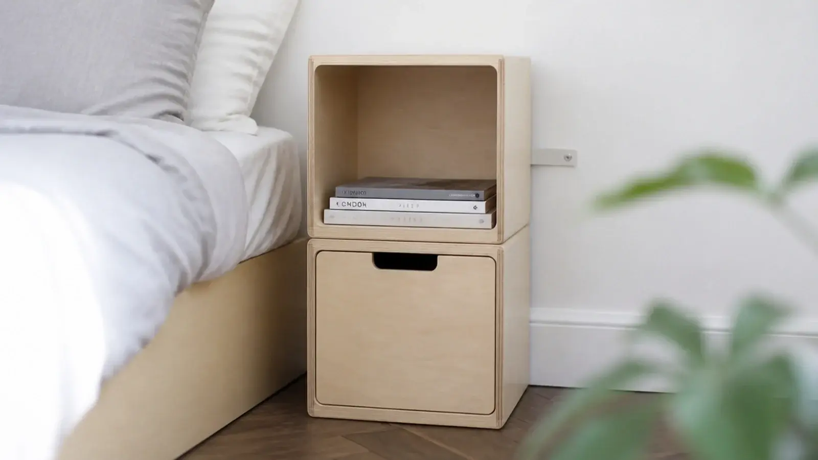 two stackable storage cubes assembled as a bedside unit with strap