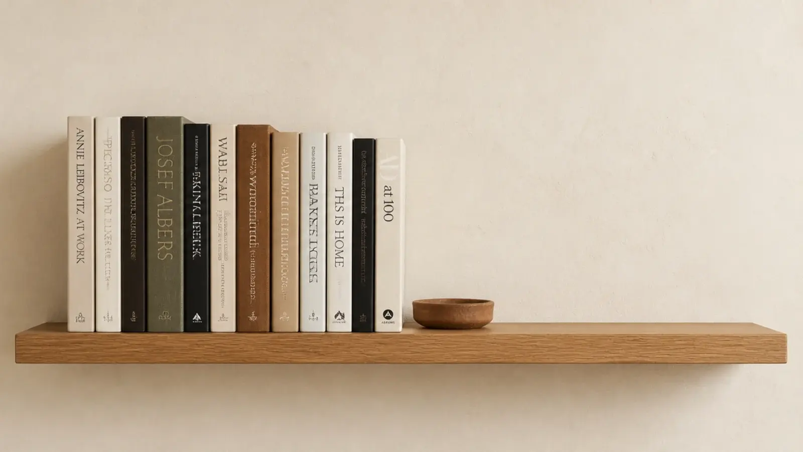 bookshelf styling with books filling two thirds and a clear open gap