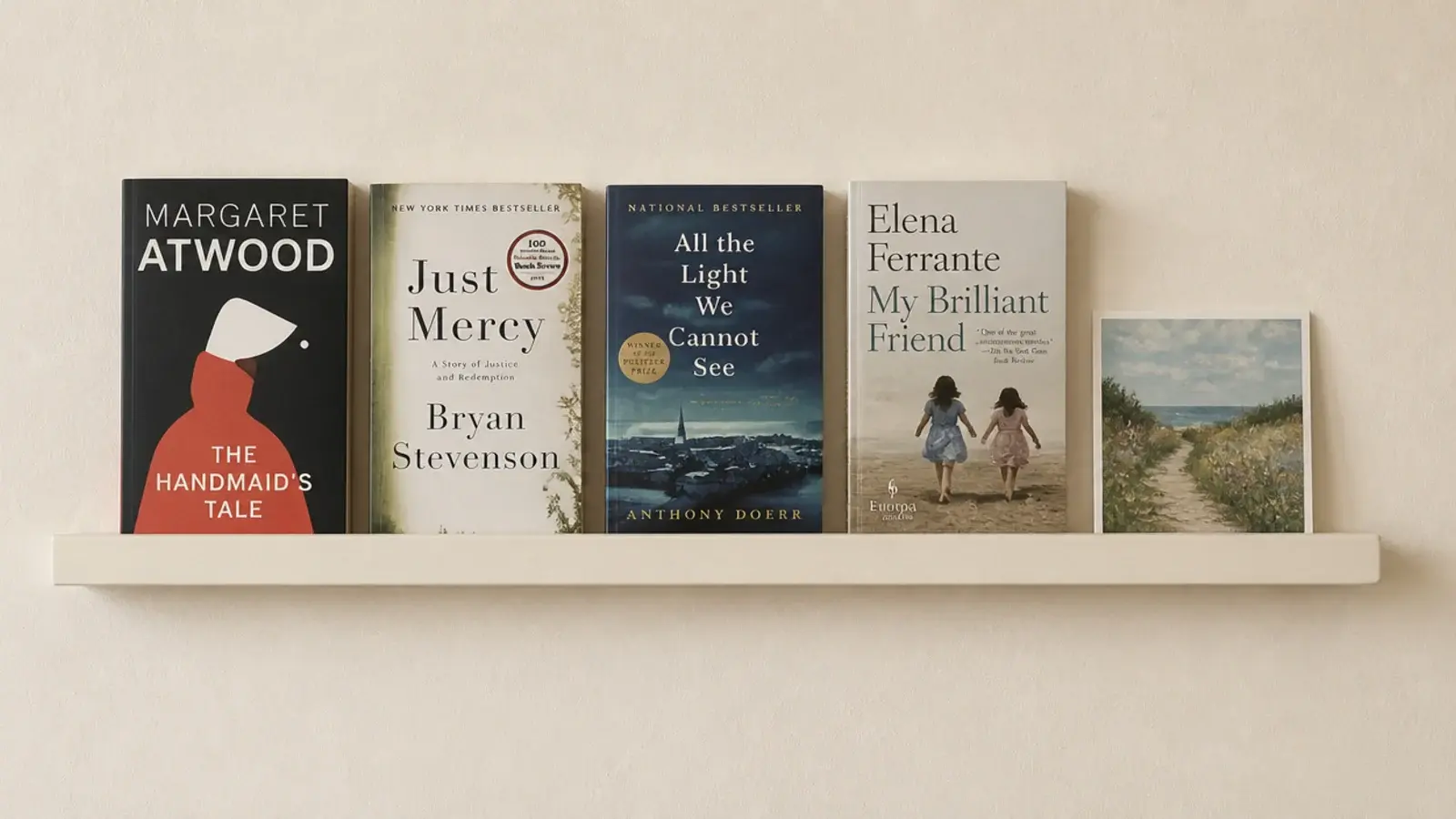 narrow adhesive picture ledge holding paperbacks forward facing on a wall