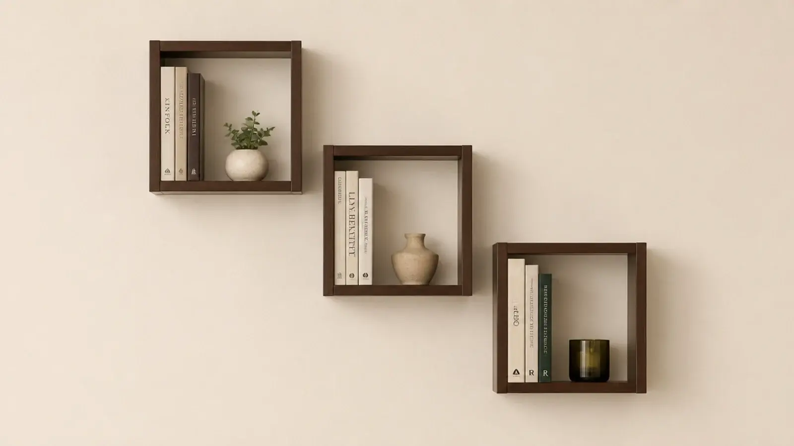 three twelve inch floating cube shelves arranged on a small wall