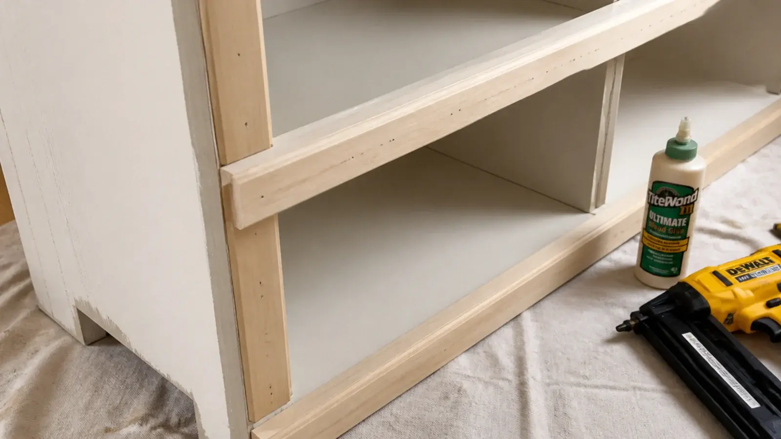 poplar face frame pinned over the raw front edges of budget shelves