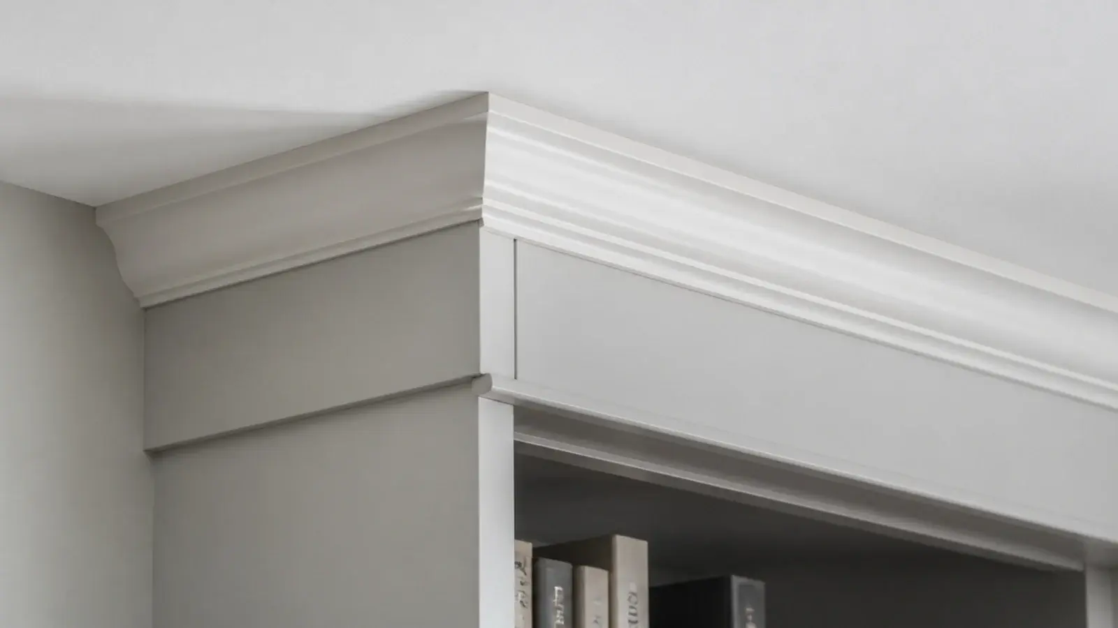 crown molding closing the gap where built in shelves meet the ceiling