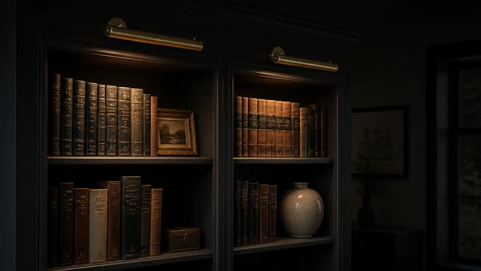 brass picture lights washing warm light down styled built in shelves