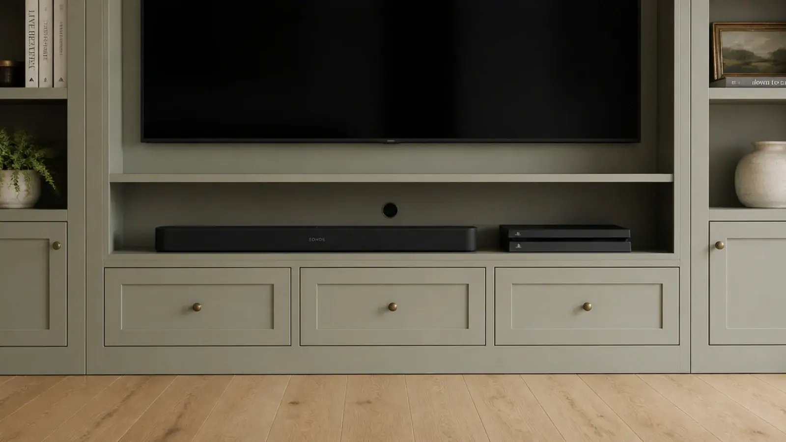 low media cabinet base within living room built-ins holding a soundbar