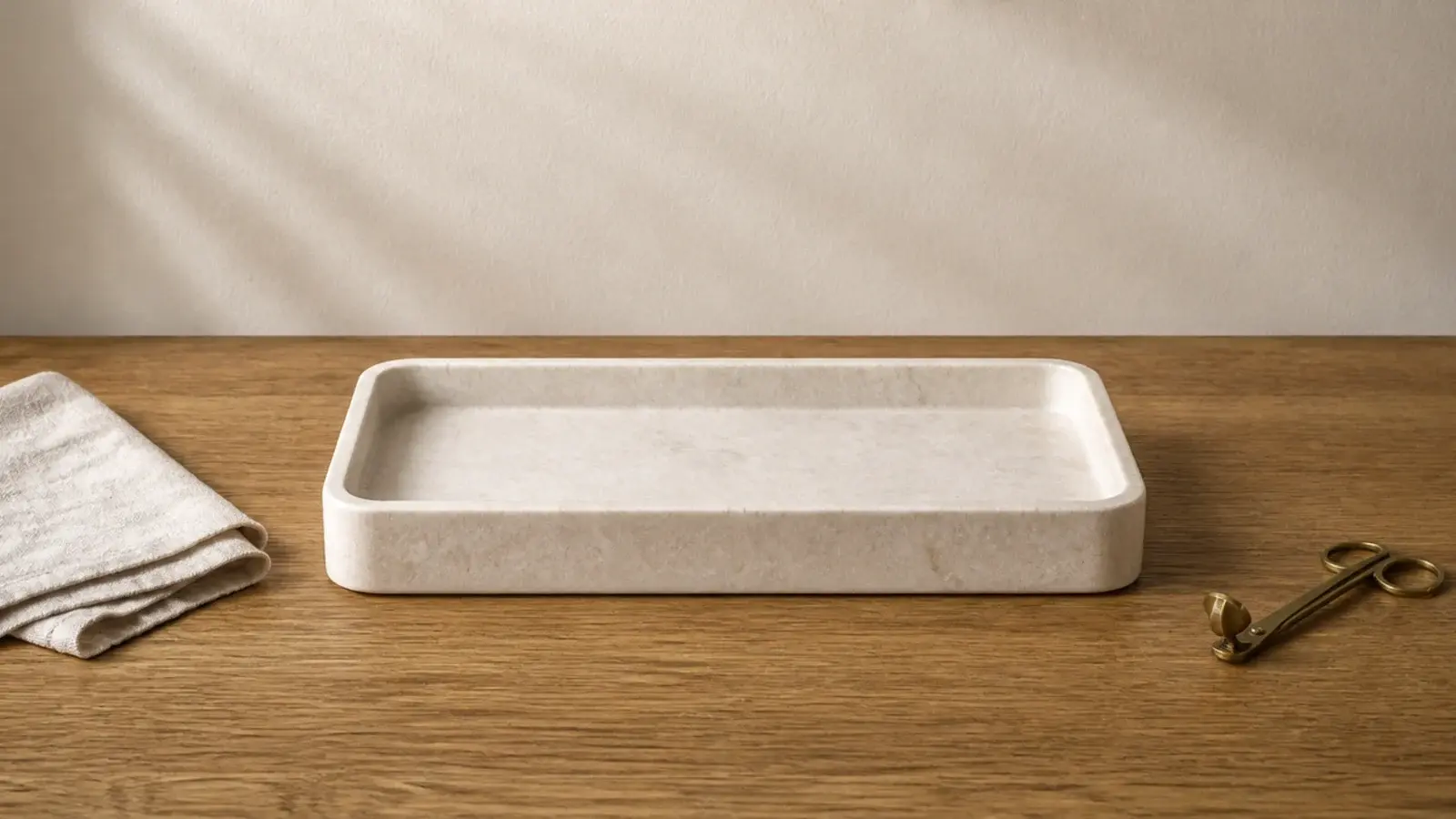 empty stone tray on a wooden table waiting for candle tray styling to begin