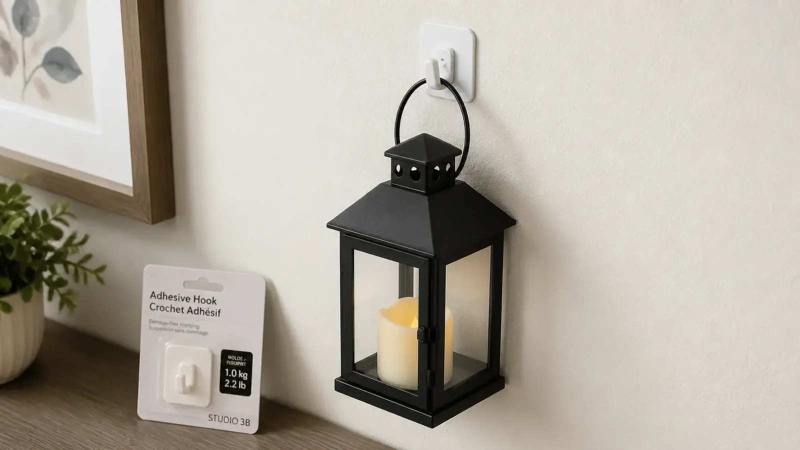 adhesive wall hook holding a lightweight lantern in a rental hallway