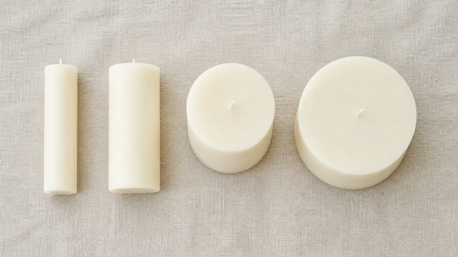 pillars of four different widths in the same ivory wax color