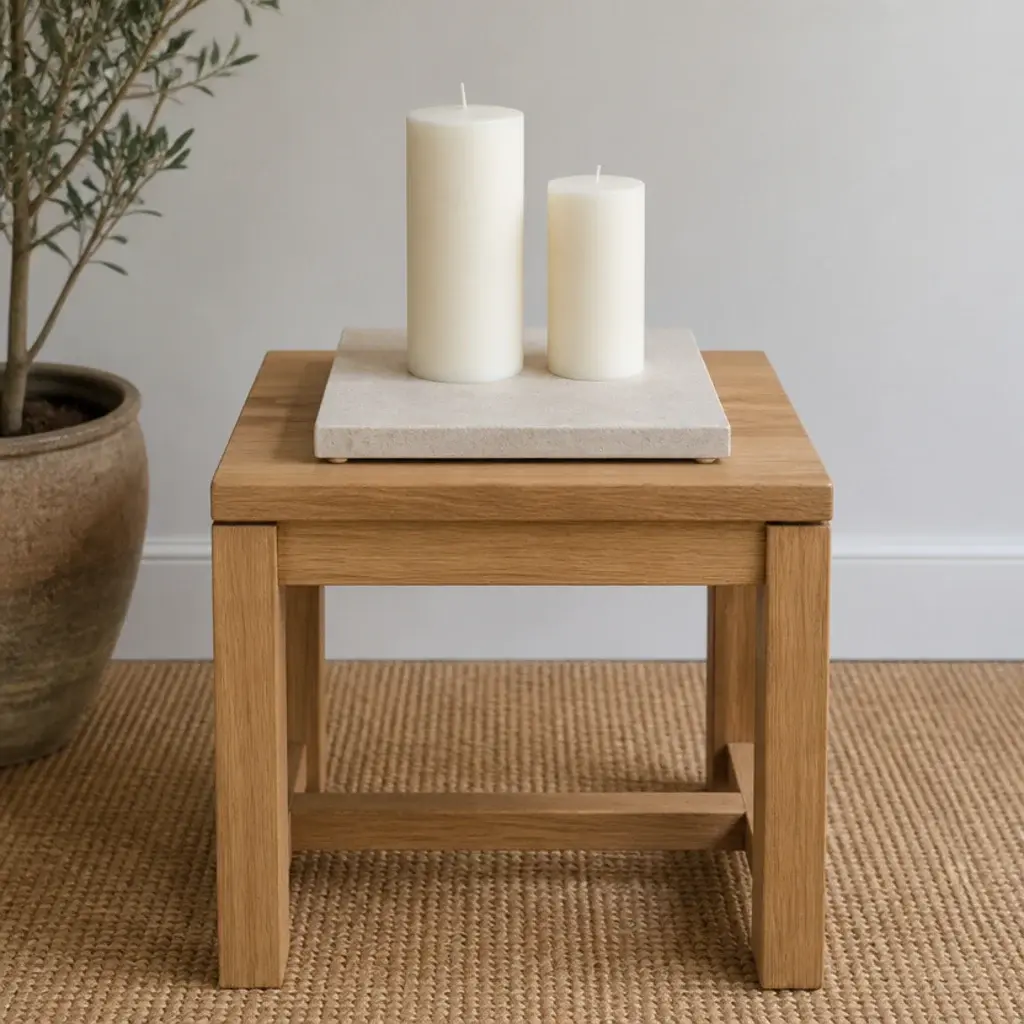 square stone tile used as a heatproof base under pillar candles