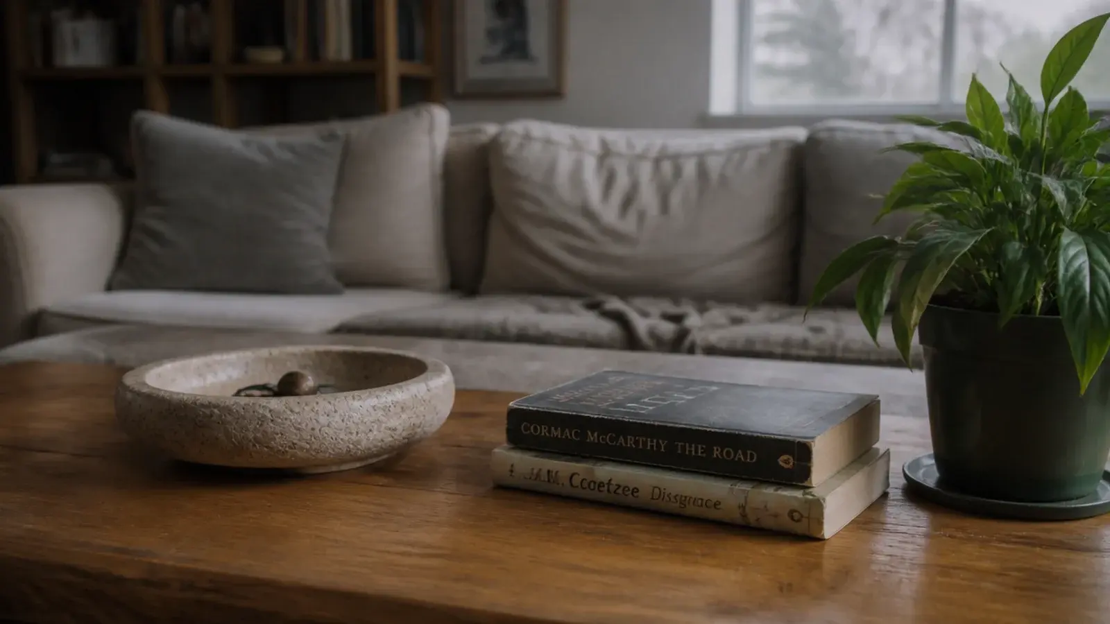 center table living room decoration with a low bowl books and no tall vase