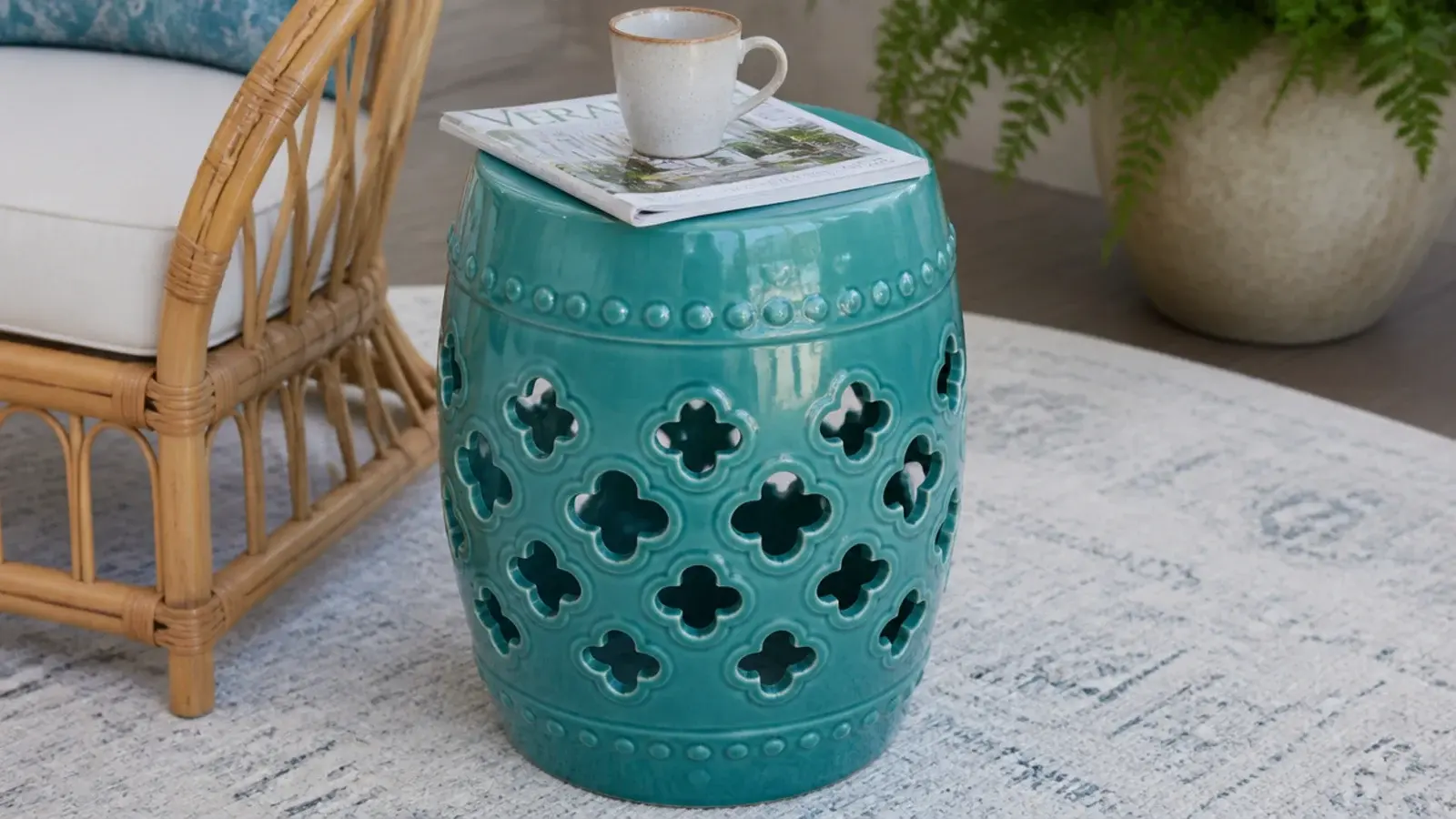 glazed ceramic garden stool doing duty as a small center table