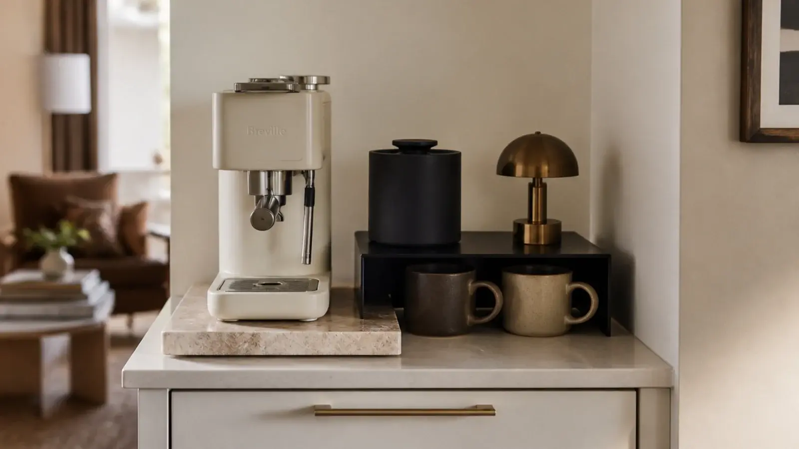 stylish apartment coffee bar with dark riser mugs and a bean canister