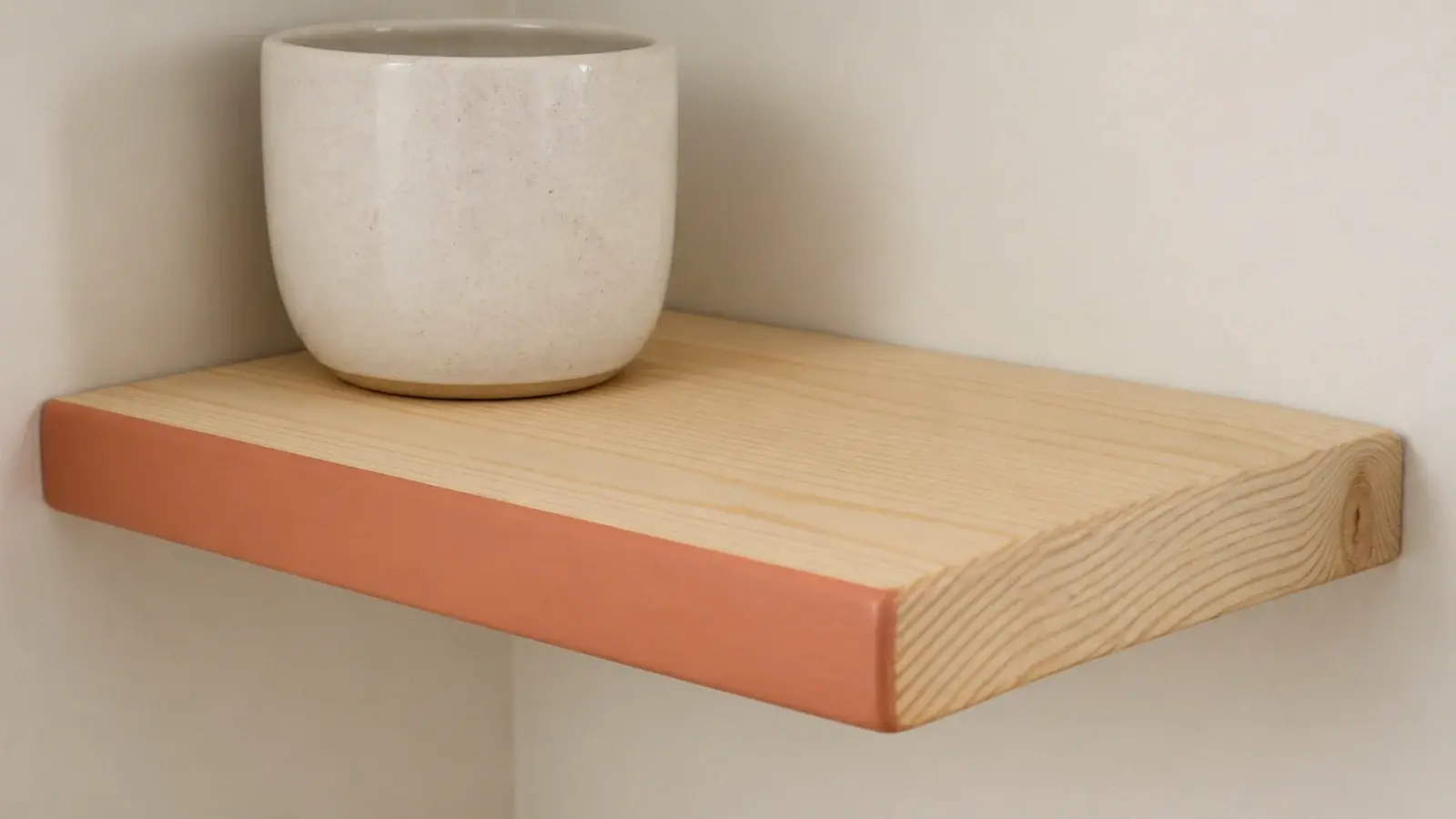 pine corner shelf with just the front edge painted a soft clay tone
