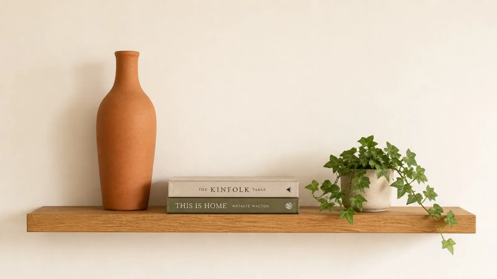 shelf styled in a clear triangle with tall medium and low objects marked