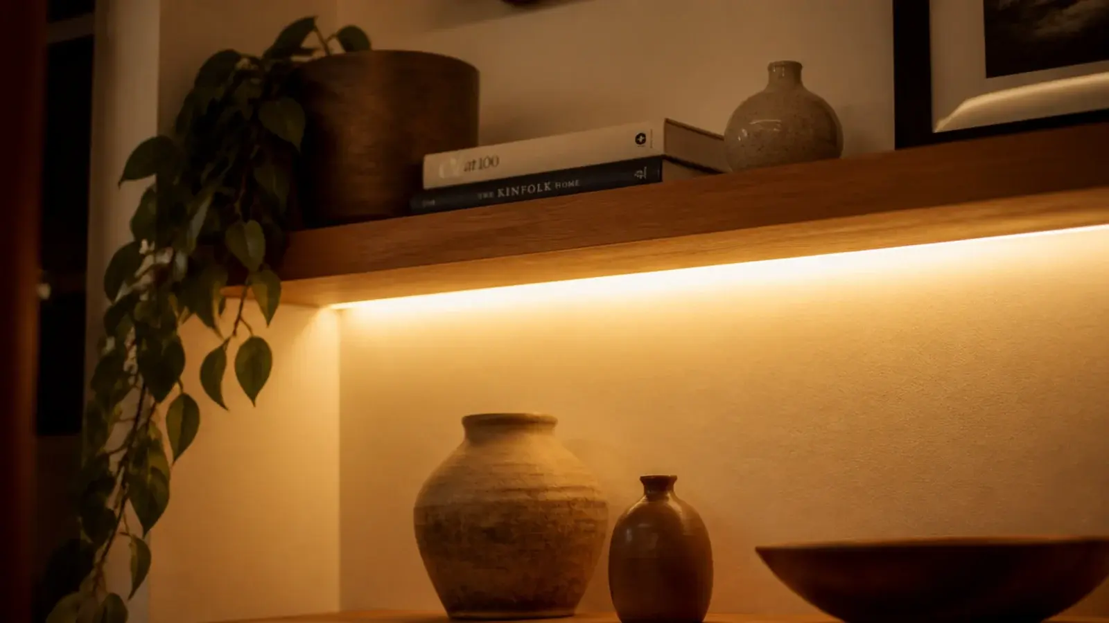floating corner shelf with a hidden warm led strip glowing underneath