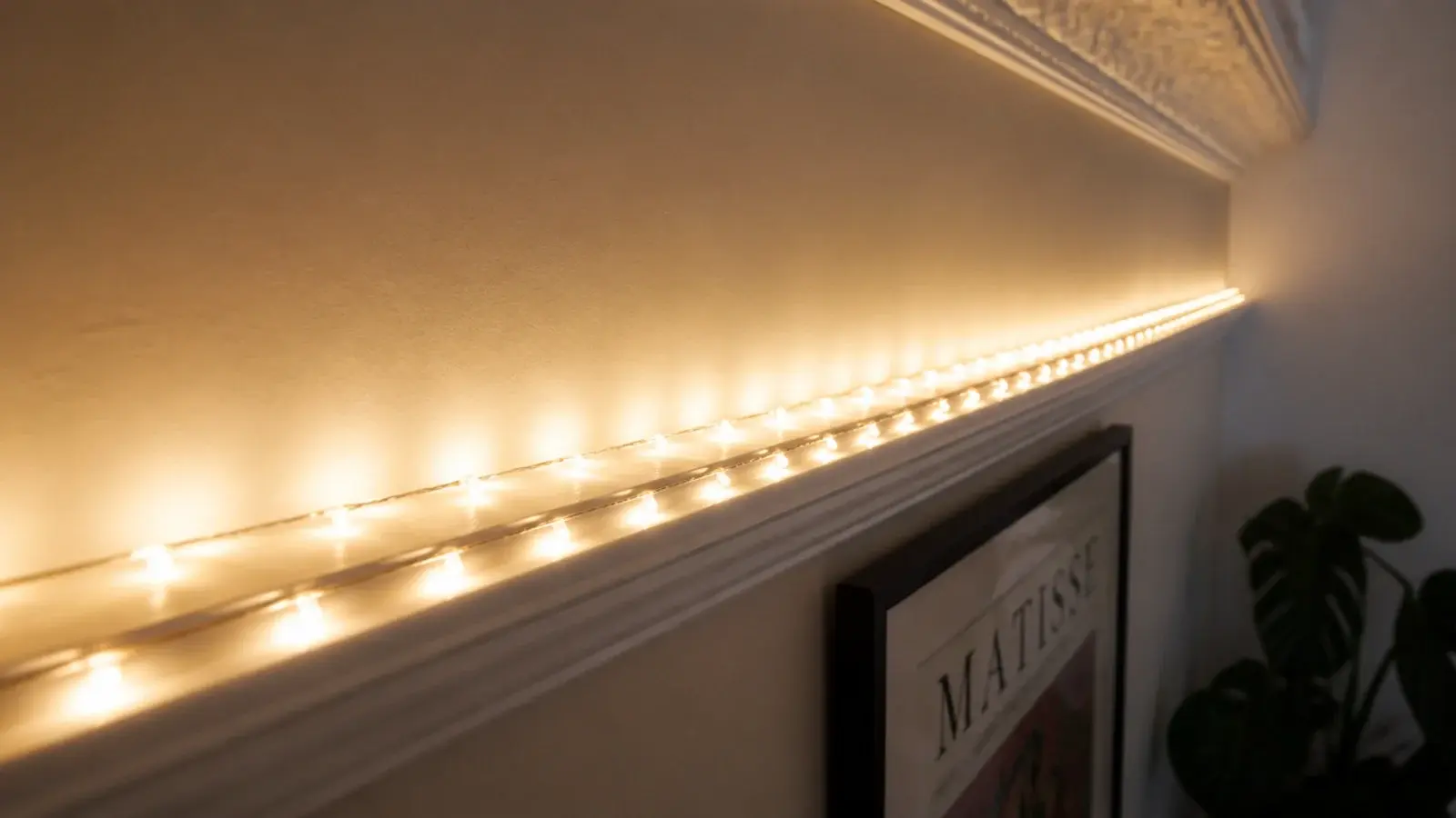 two parallel light strands running along a picture rail line