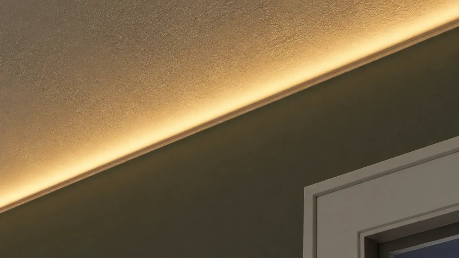 lights tucked into the shadow line where ceiling meets wall