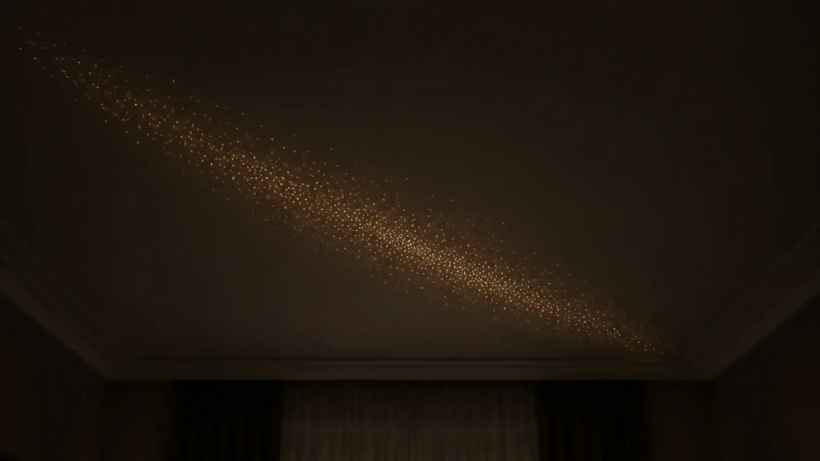 dense band of tiny lights running diagonally across a ceiling