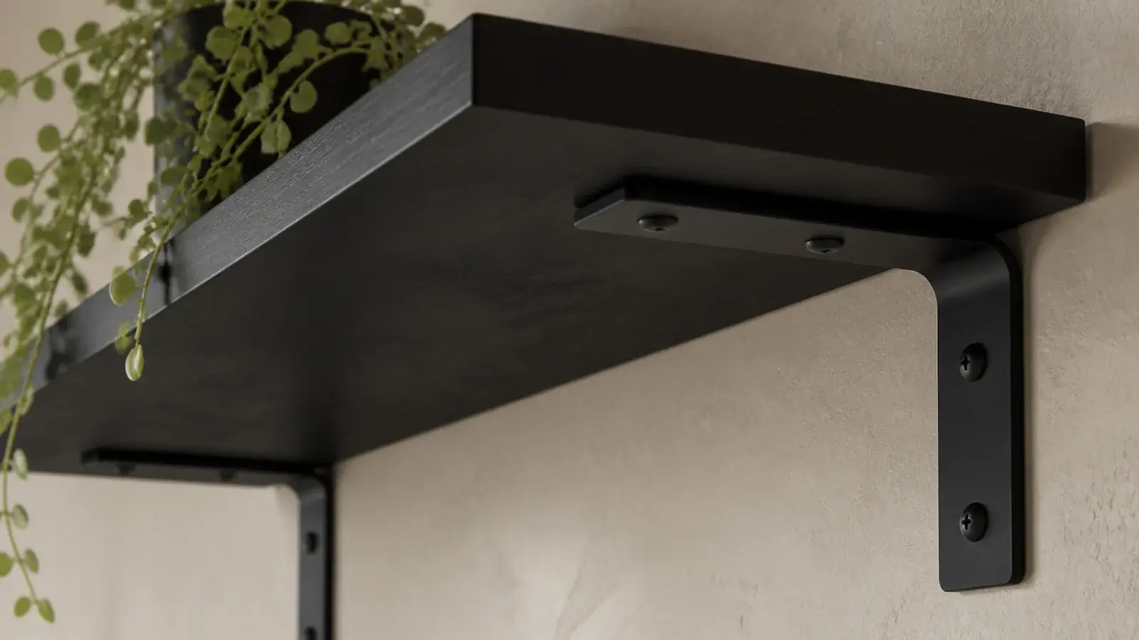 black powder coated L brackets shown on purpose under a dark shelf