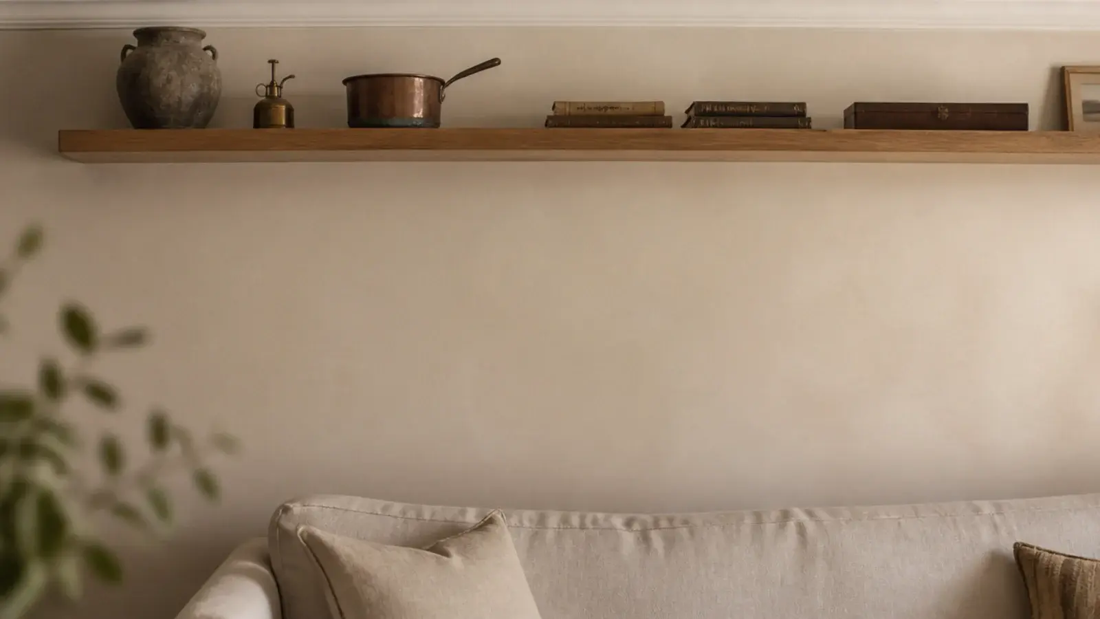 floating shelf mounted near the ceiling holding dusty unreachable objects