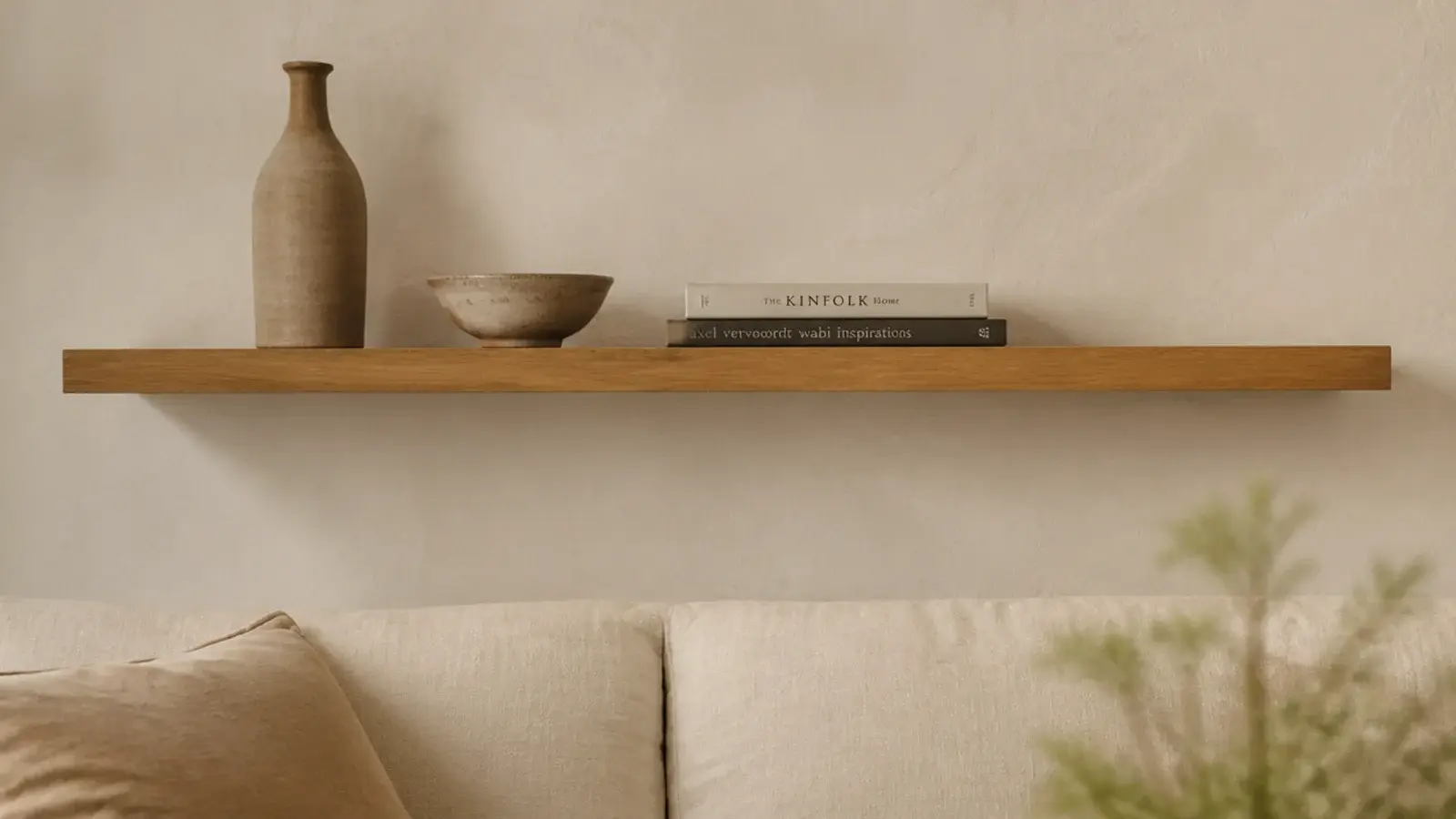 empty living room wall transformed with one long oak floating shelf