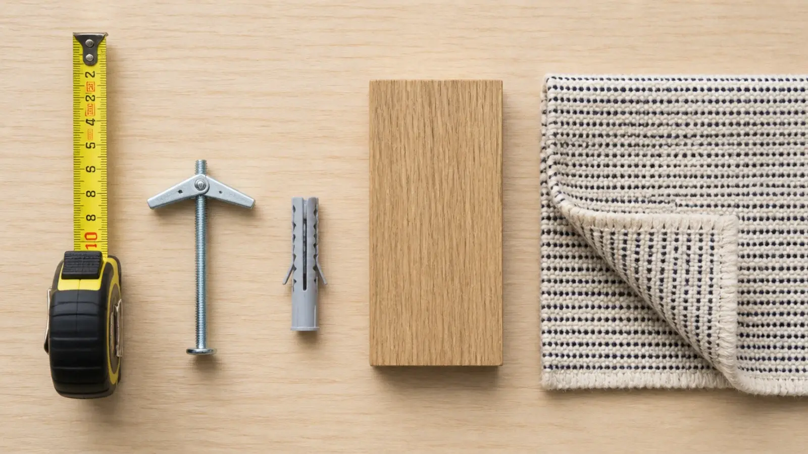 tape measure and hardware laid out for testing entryway console depths
