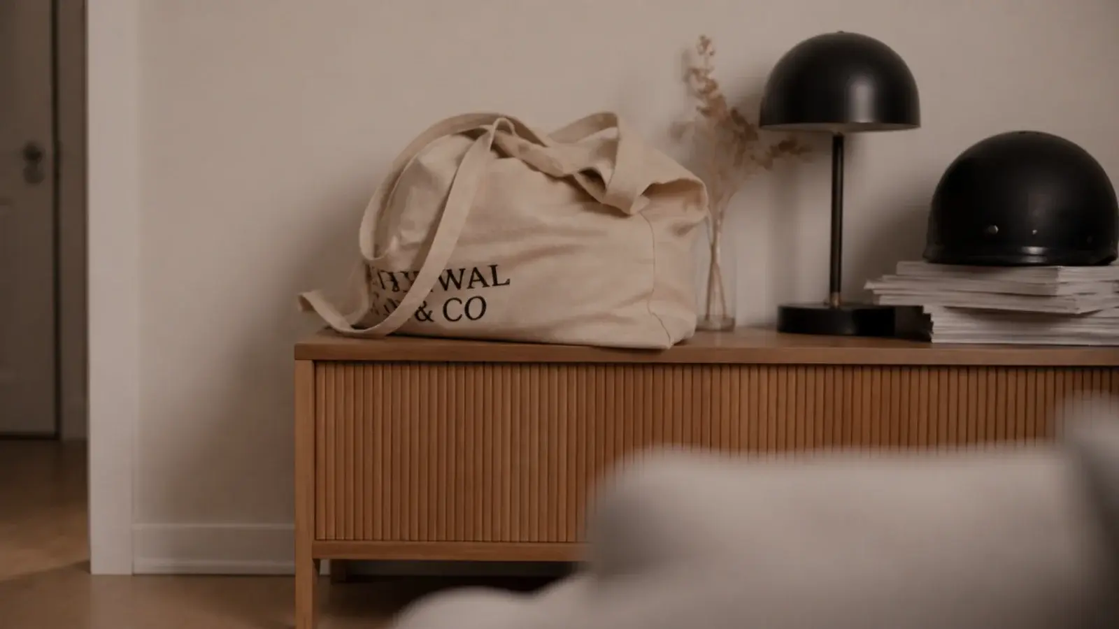 styled entry console covered in bags and post despite careful styling