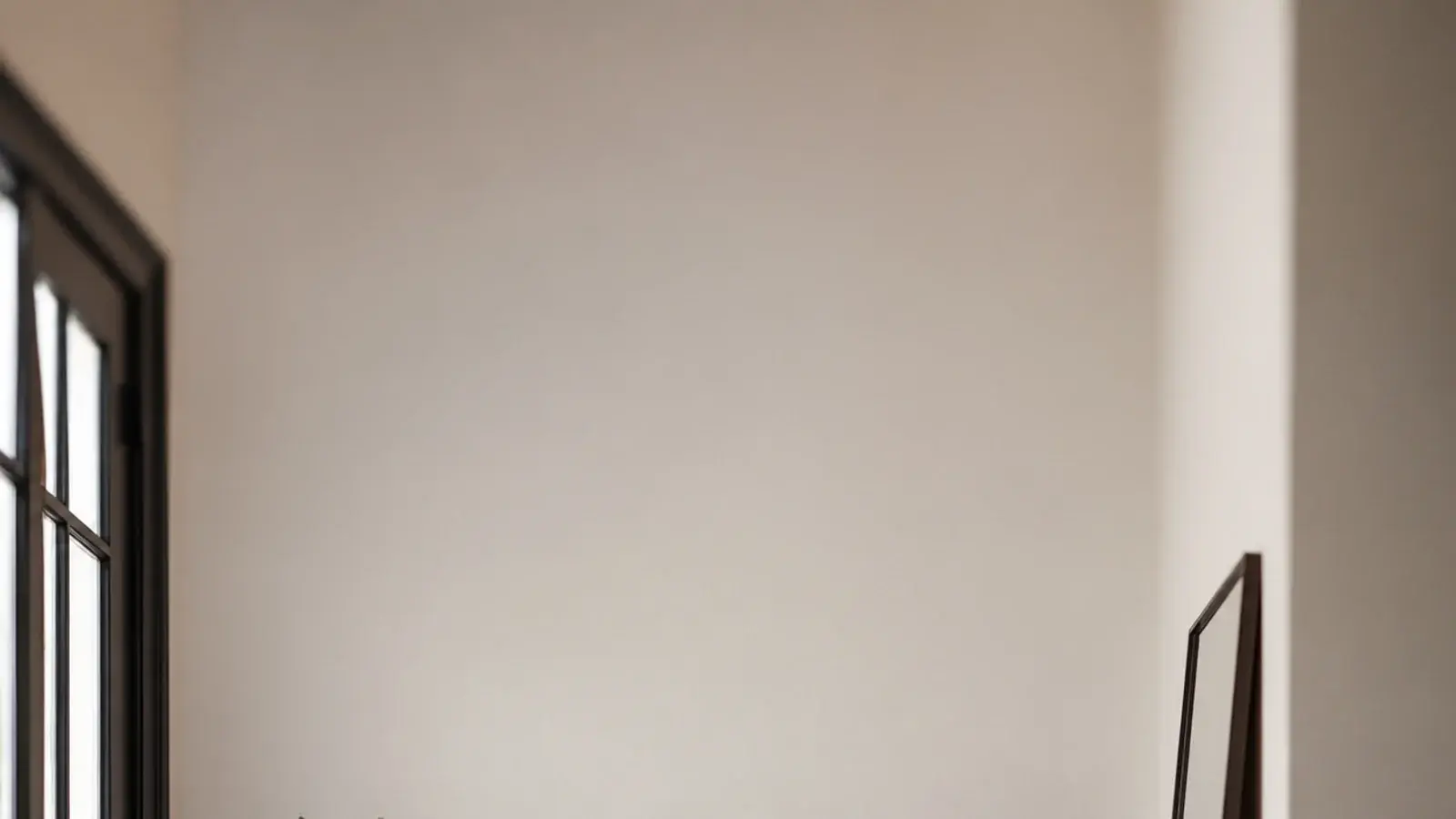 vertical image of entryway mistakes fixed with correct hook and mirror heights