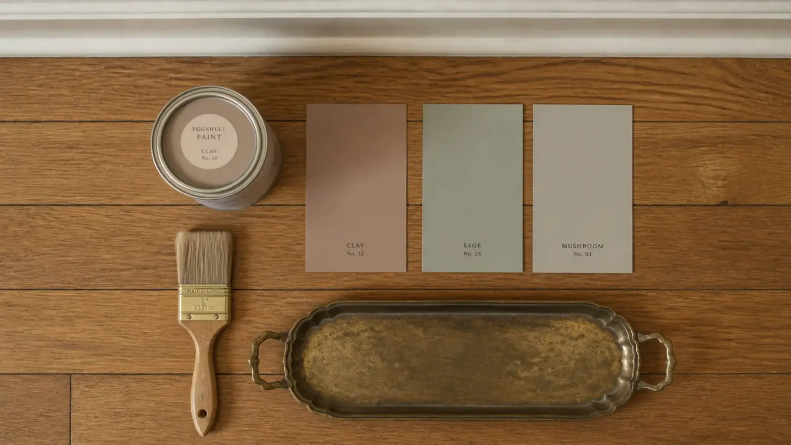 paint samples and a thrifted tray laid out on a foyer floor