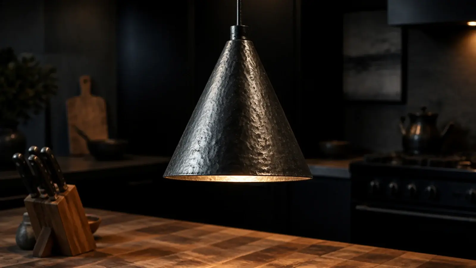 blackened steel pendant showing hand worked marks in the finish