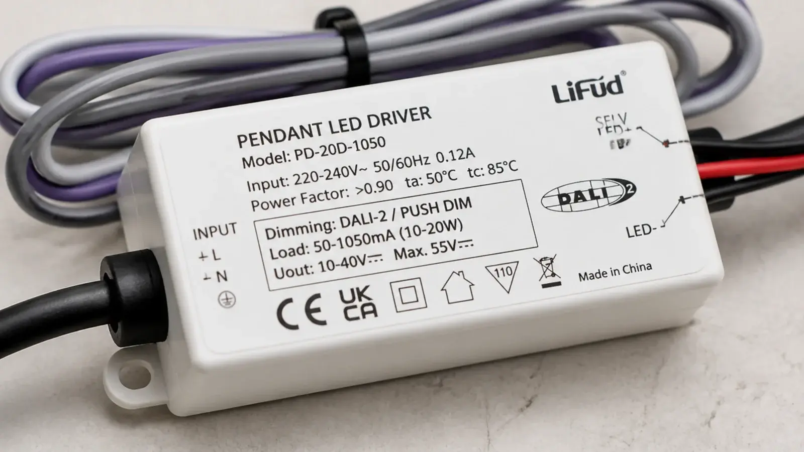 wiring label on a pendant driver naming its dimming protocol