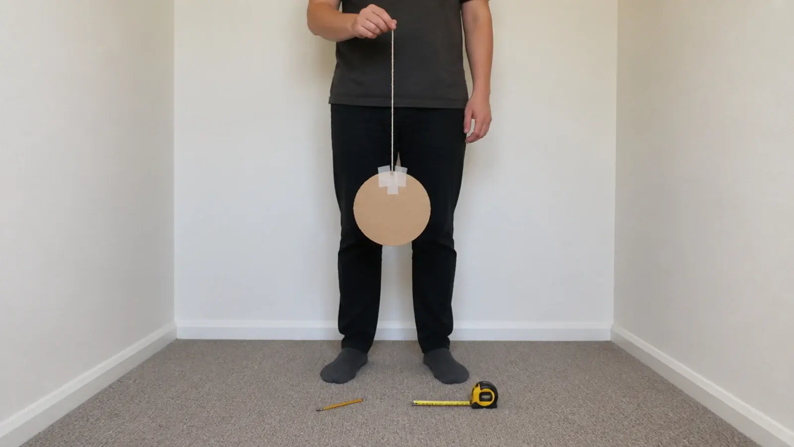 cardboard circle held at ceiling height to test a shade size