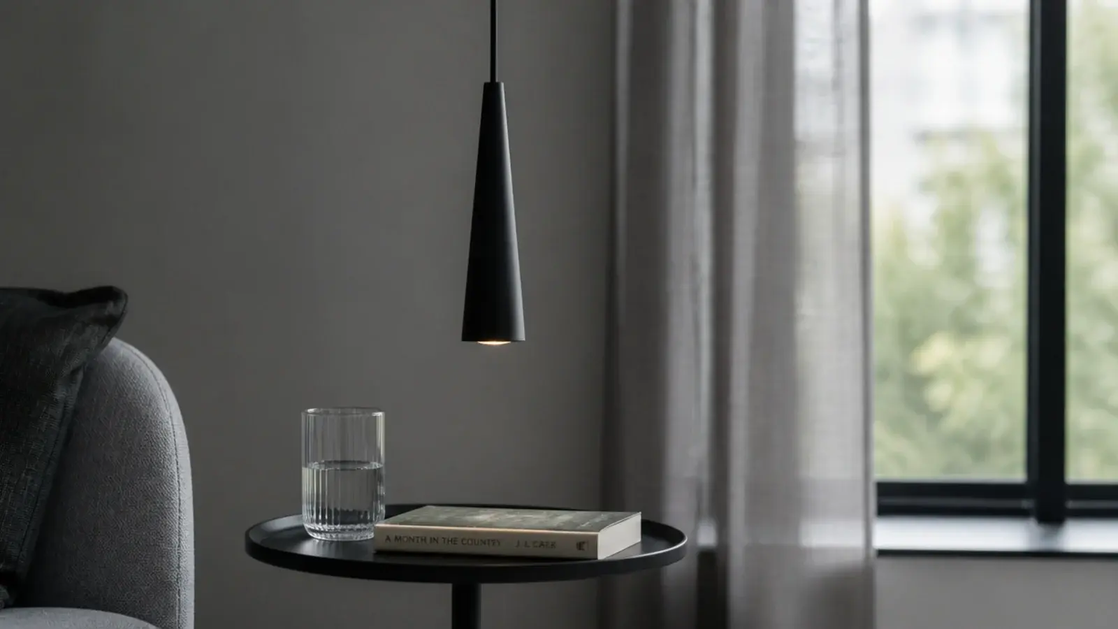 narrow metal cone pendant with a very small visual footprint