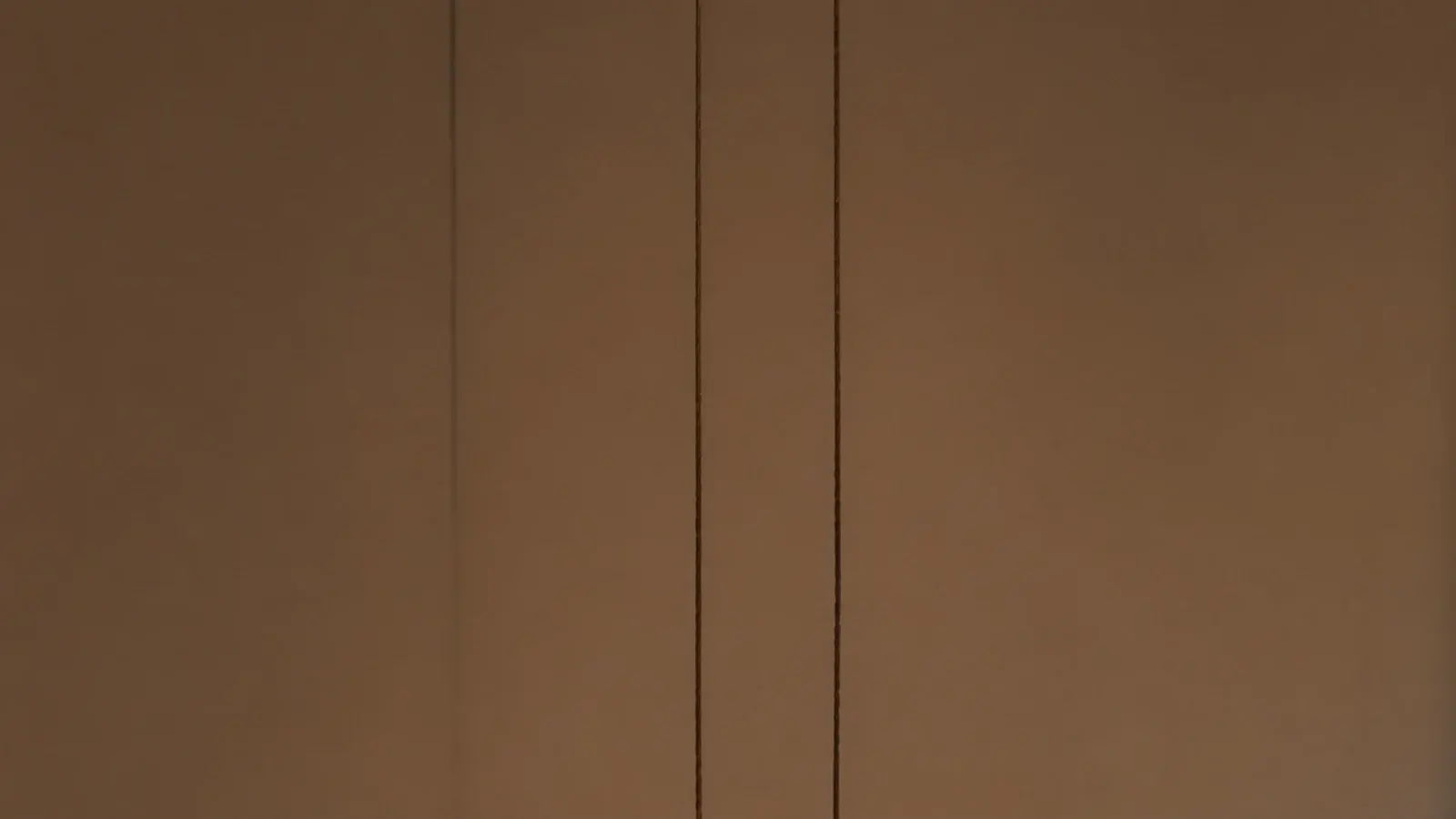 tall view of small hanging pendant lights in a compact interior