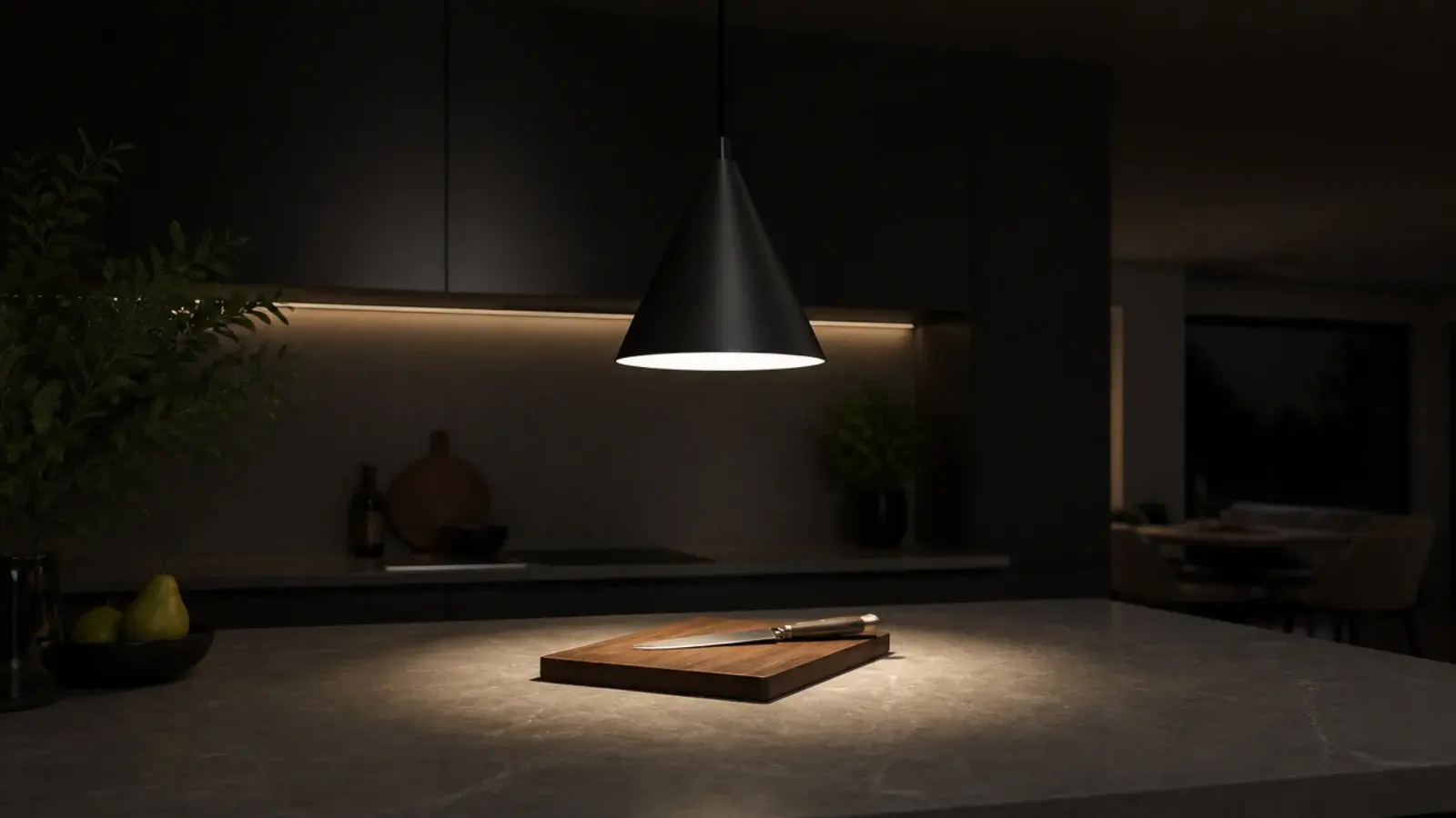 matte black cone pendant throwing a tight pool onto a counter